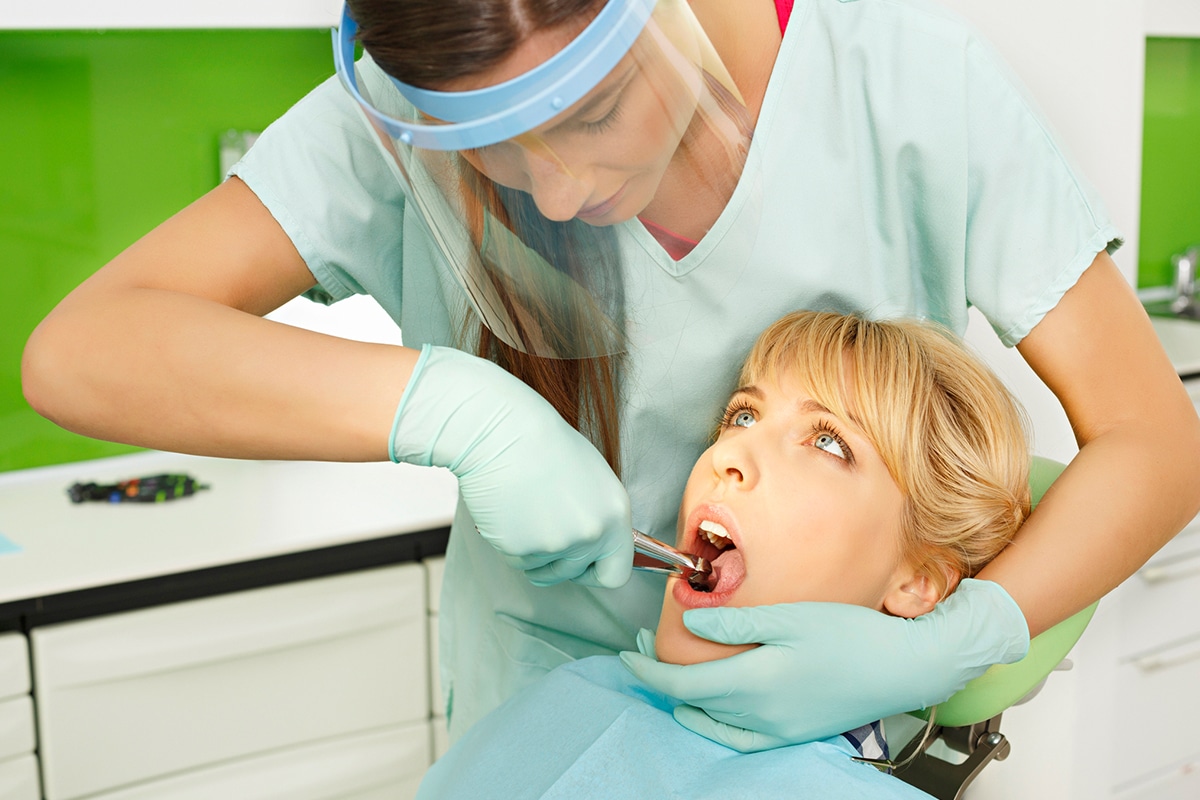 how-do-you-stop-bleeding-after-a-tooth-extraction-suwanee-family